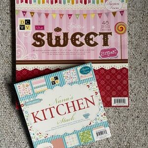 DCWV Scrapbook paper/cardstock. 48 sheets of 8x8 and 48 sheets of 12x12.